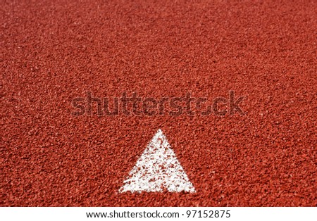 arrow sign on running track rubber cover texture for background