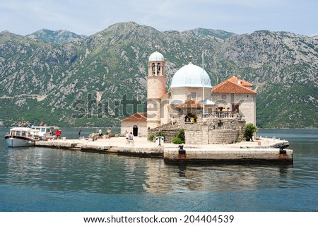 Perast, Montenegro - 24 June 2014: Tourists visiting Our lady of the rock island on Kotor bay, Montenegro