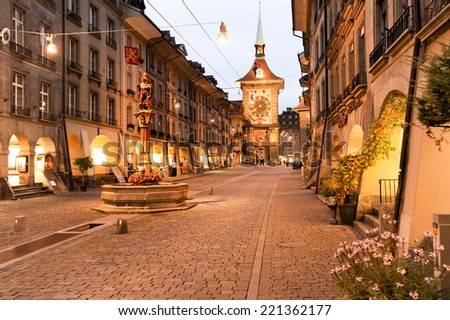 Bern, Switzerland - 17 September 2013: People on the shopping alley with the famous clocktower of Bern on Switzerland