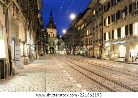 Bern, Switzerland - 17 September 2013: People on the shopping alley with the famous clocktower of Bern on Switzerland
