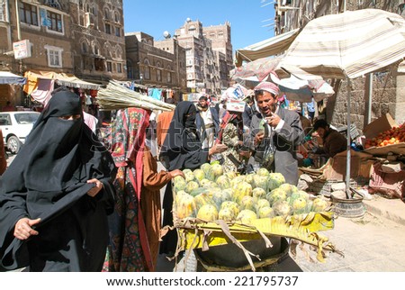 Sana, Yemen - 1 January 2008: people walking and buying on the market of old Sana on Yemen