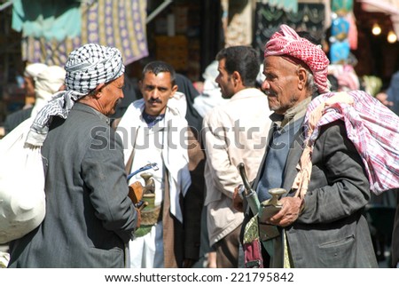 Sana, Yemen - 19 January 2008: people in conversation on the main square of old Sana on Yemen