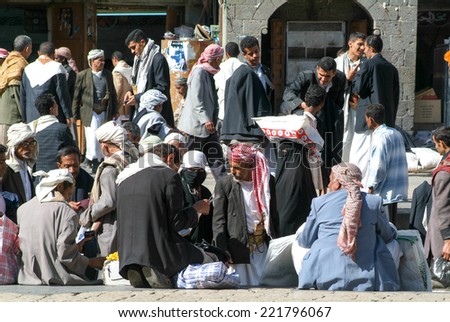 Sana, Yemen - 19 January 2008: people in conversation on the main square of old Sana on Yemen
