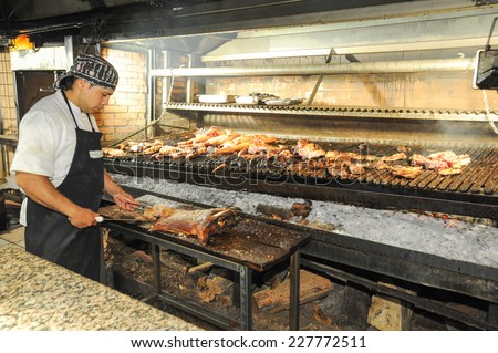 Mendoza, Argentina - 16 January 2011: a cook on the bbq grill at a restaurant of Mendoza, Argentina