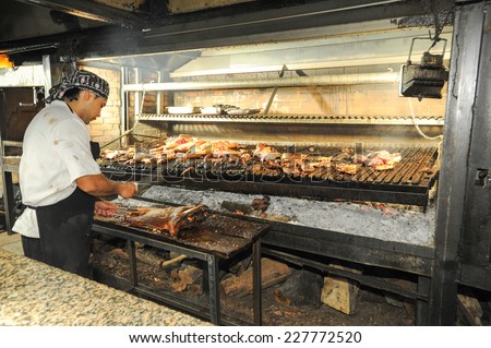 Mendoza, Argentina - 16 January 2011: a cook on the bbq grill at a restaurant of Mendoza, Argentina