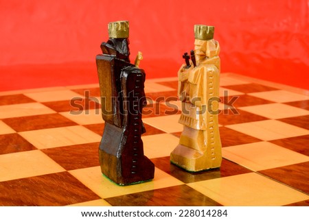 Chess board with a duel of two kings
