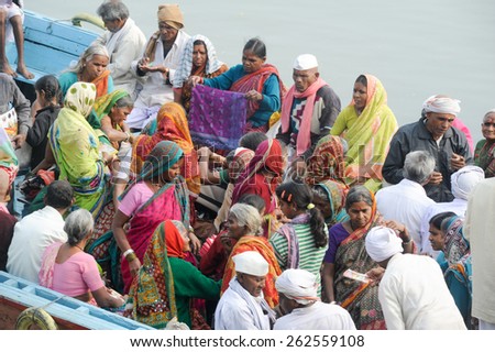 Varanasi, India - 28 January 2015: Indian tourists taking the popular boat tour on the sacred Ganges river in Varanasi, Uttar Pradesh, India