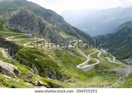 Old road with tight serpentines on the southern side of the St. Gotthard pass bridging swiss alps