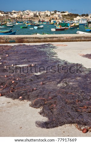 Drying fishing net in the fishing village Marsaxlokk, Malta