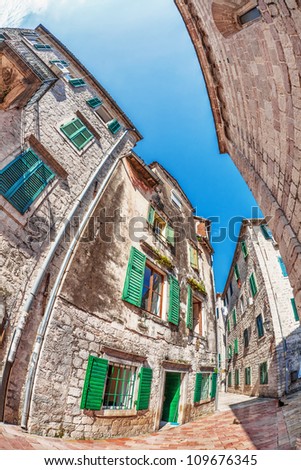 Fish-eye lens look of the old city on sky background. Kotor. Montenegro