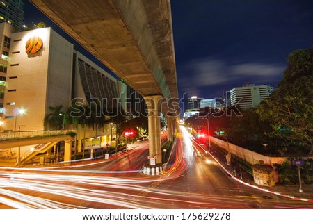 Bangkok, Thailand - July 30, 2007: Night Scenery Of One Of The Central Streets Of Bangkok. In The Centre Of Bangkok Heavy Traffic Does Not Stop Even At Night.