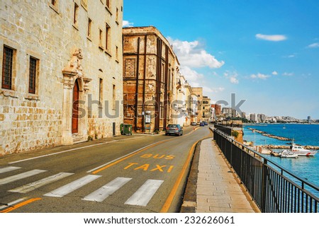 NAPLES, ITALY - JULY 3, 2007: Car rides along the promenade of Naples. Naples is the third largest city of Italy, located 230 km south of Rome, on the Tyrrhenian Sea, not far from volcano Vesuvius.