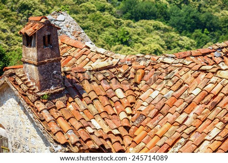 Red roof of old house in mountains. Montenegro