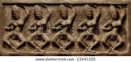 Dancings. Traditional Thai a bas-relief of wall. It is photographed on kho Chang island. Thailand