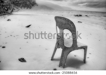 The old plastic chair thrown on the relax beach. Tioman island. Malaysia