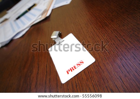 press identification card on the table , press concept , press id