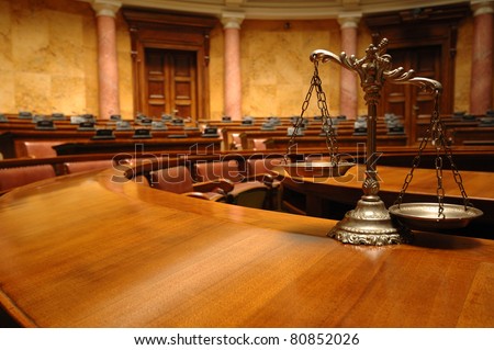 Symbol of law and justice in the empty courtroom, law and justice concept. - stock photo