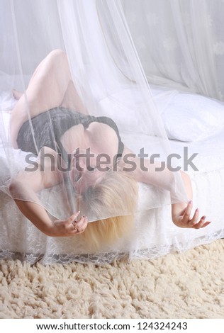 stout good young woman in black lingerie on white bed with  canopy/Morning