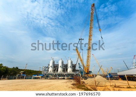 Natural gas and Oil industrial site with a big crane