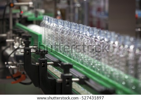 Clear Bottles transfer on Conveyor Belt System