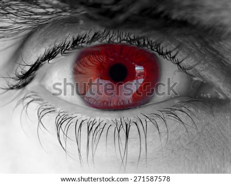 human eye red colored close up detail