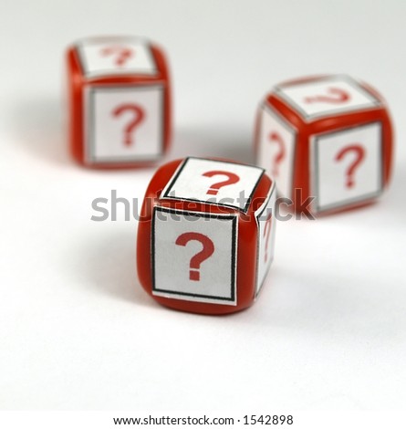 red dices with question simbol printed on a white background   (selective focus on first die)