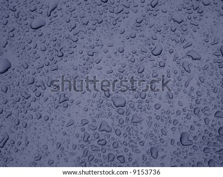 water drops over grey metallic surface