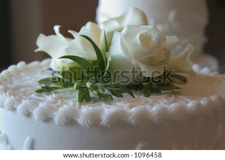 stock photo Wedding cake with a white rose on top