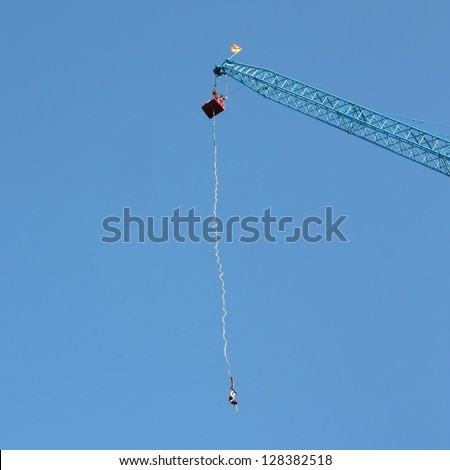 HELSINKI, FINLAND - JULY 27: Bungee jumping from a crane on July 27, 2012 in Helsinki. The height of the jump is 150 meters, the speed gained during a jump is about 120 km/h.