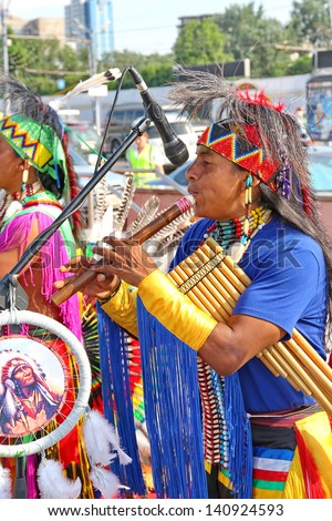 MOSCOW, RUSSIA - JUNE 1: Native American Indian tribal group play music and sing in the street for tourists and city dwellers on June 1, 2013 in Moscow, Russia