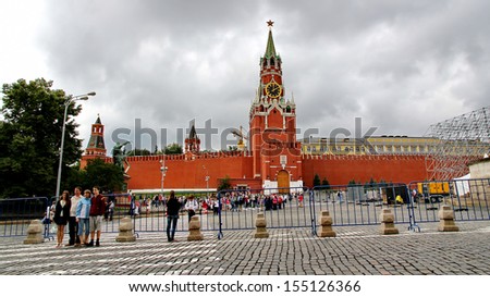 MOSCOW - JULY 20: Tourists visiting the Red Square on july 20, 2013 in Moscow, Russia. The Red Square and the Kremlin are the main attractions in Moscow