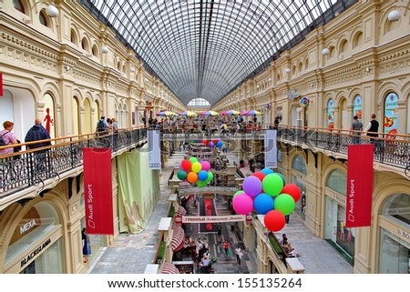 MOSCOW - JULY 20: Inside GUM department store in honor of 120th anniversary of the trading house GUM on July 20, 2013 in Moscow. There are about 200 stores and it is popular for international tourists