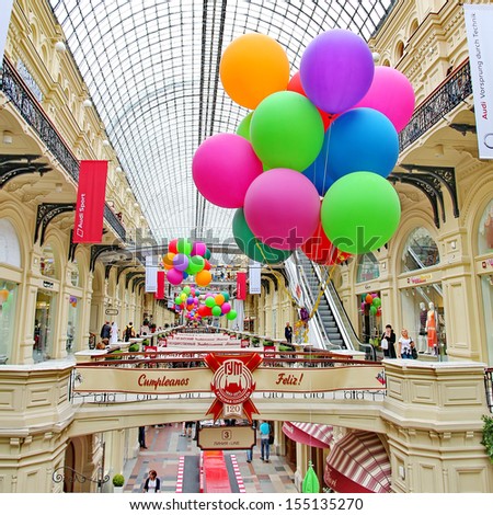 MOSCOW - JULY 20: Inside GUM department store in honor of 120th anniversary of the trading house GUM on July 20, 2013 in Moscow. There are about 200 stores and it is popular for international tourists