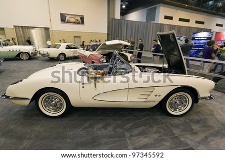 HOUSTON - JANUARY 28: A classic 1960 white Corvette  at the Houston International Auto Show on January 28, 2012 in Houston, Texas.