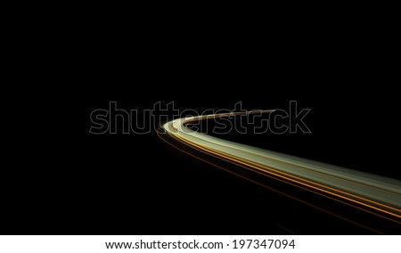 Truck and car light trails in tunnel. Art image . Long exposure photo taken in a tunnel