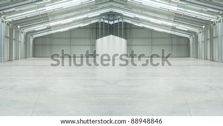 Huge light warehouse in gray with strange form