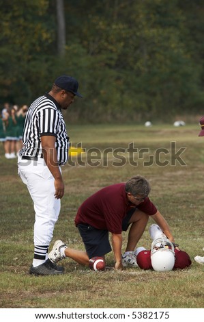 youth football player injured and on the ground