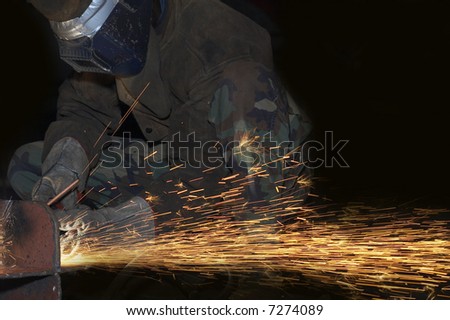 an arc welder spraying a lot of fire