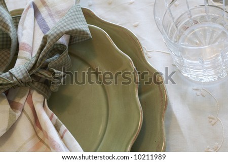 napkin, plate, and glass on dinner table