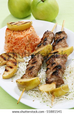 Pork sticks barbecue with rice salad germs and apples