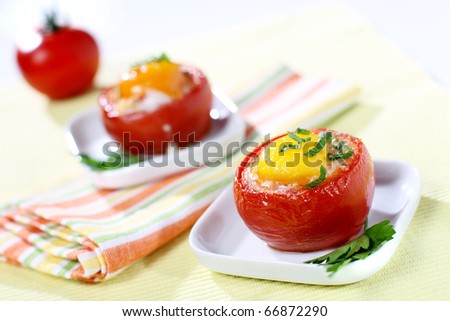 Fresh stuffed tomato with egg and parsley