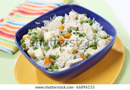 Fresh all season salad with rice, chicken, cheese and other vegetables