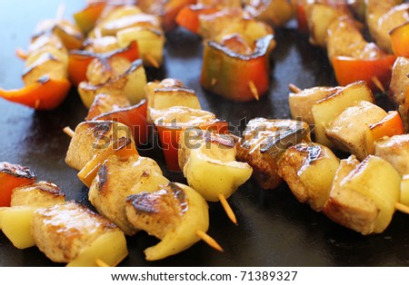 Golden sizzling barbecue sticks with meat and vegetables
