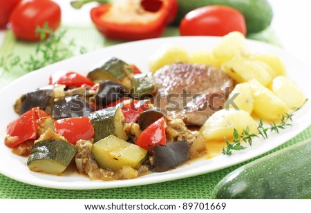 Delicious traditional vegetable ratatouille with stake and potato