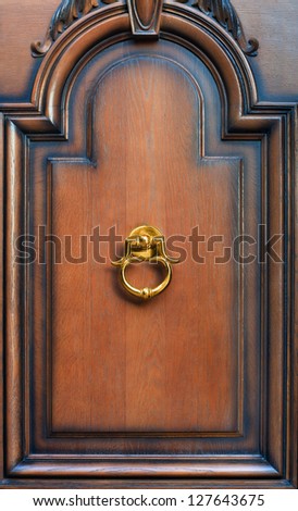 Modern door knock on brown background