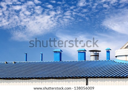 Blue kitchen chimneys on top of the roof