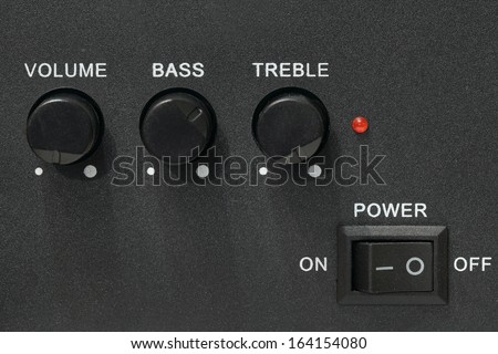 Sound system control panel with on and off, volume, bass and treble controls