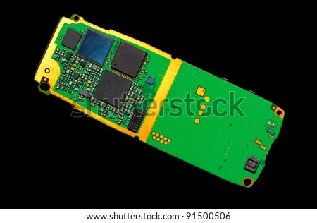 Circuit board of a cell phone isolated on black