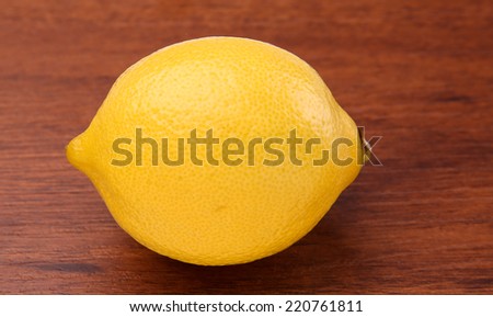 Fresh lemon isolated on wood