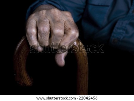 Old man holding walking stick